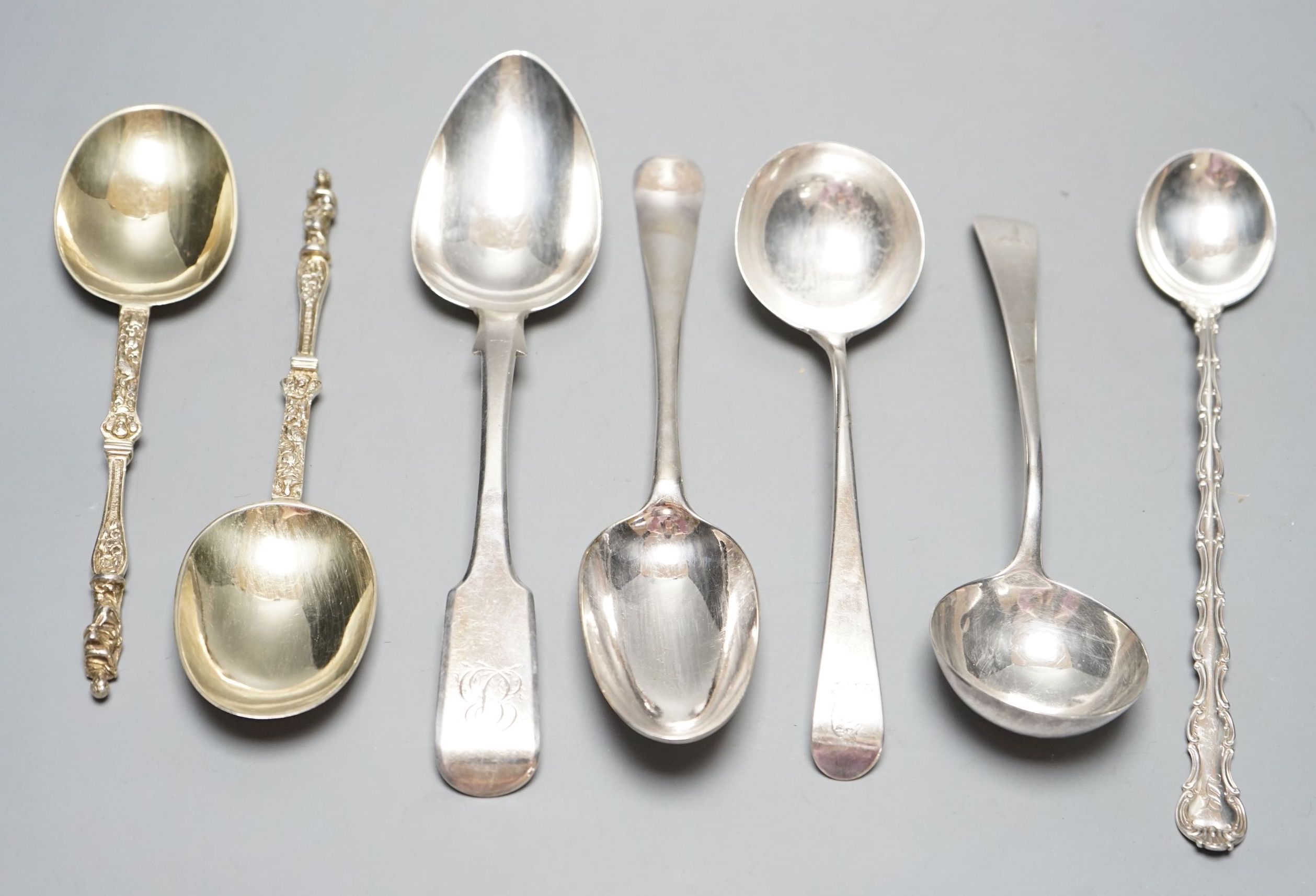 A pair of George III silver Old English pattern sauce ladles, London, 1782, 18cm, a pair of Victorian silver gilt apostle spoons, London, 1877, two Georgian silver spoons, London, 1744 & Exeter, 1818 and a sterling spoon